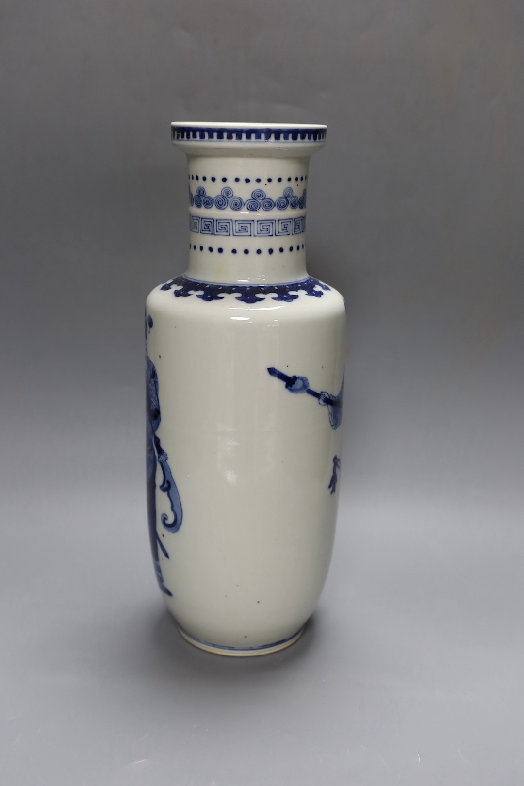 A Chinese blue and white rouleau vase, 35 cms.